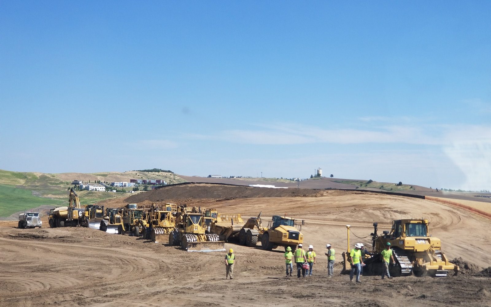 Western Construction of Lewiston scraper and dozer fleet working a mass grading project